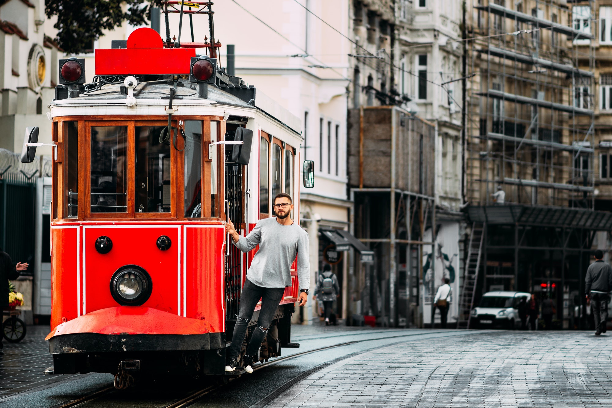 Man in a vintage tram on the Taksim Istiklal street in Istanbul. Man on public transport